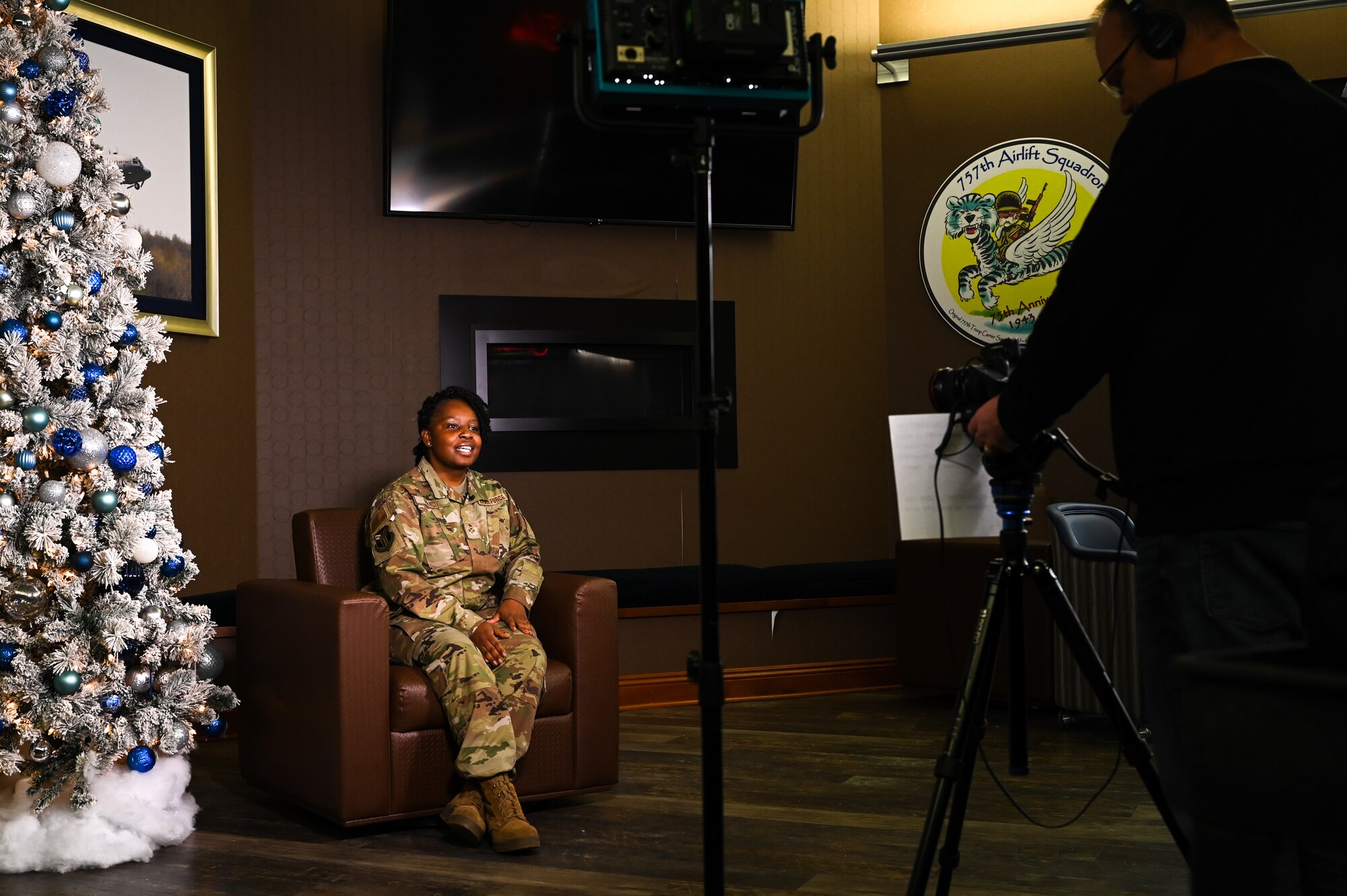 Senior Airman Jasmine Handy, operations management specialist assigned to the 910th Civil Engineer Squadron, gives a holiday greeting to her friends, family and local community, Dec. 5, 2021, at Youngstown Air Reserve Station’s Community Activity Center.