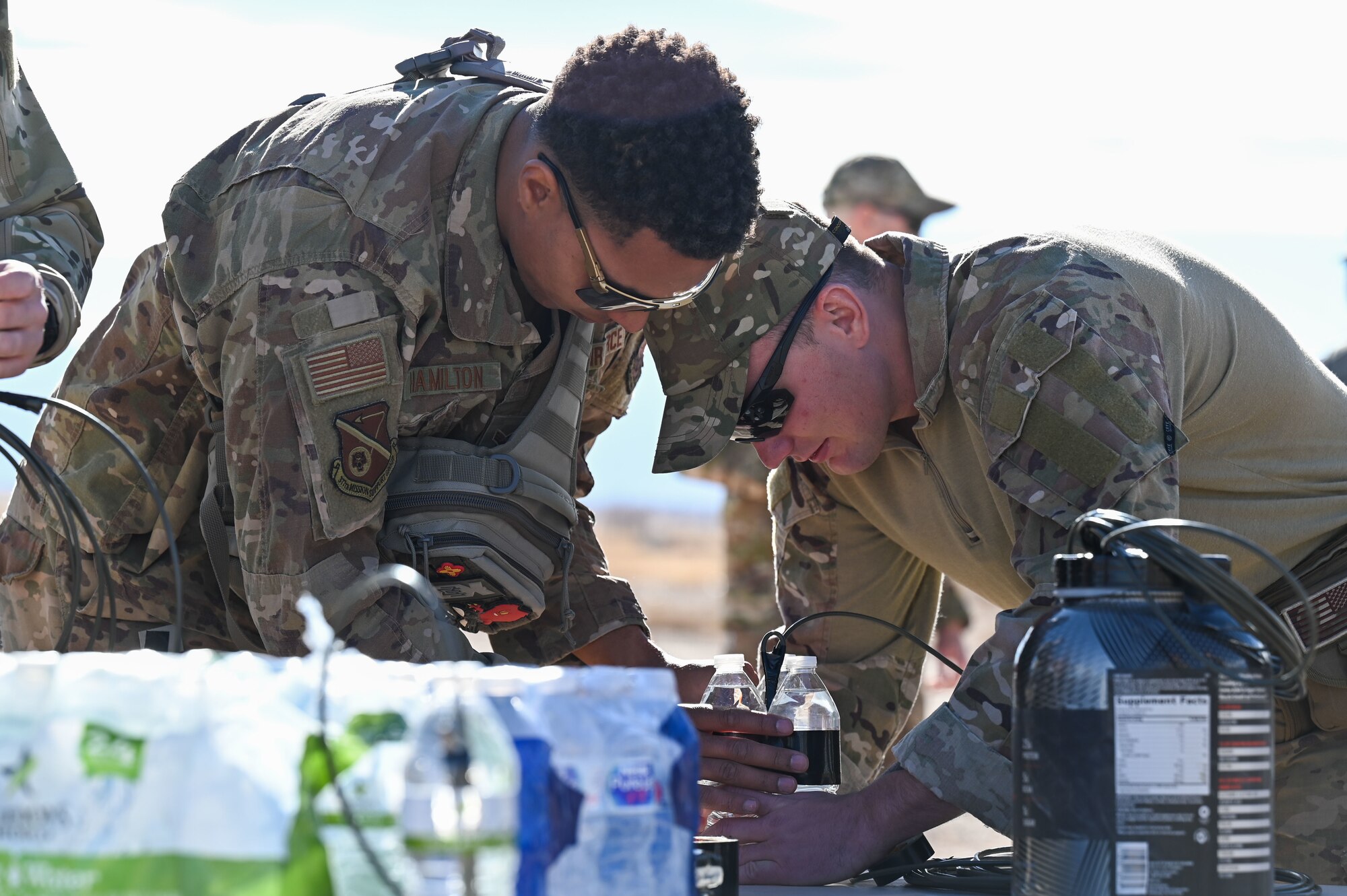 Airmen make an explosive for training.