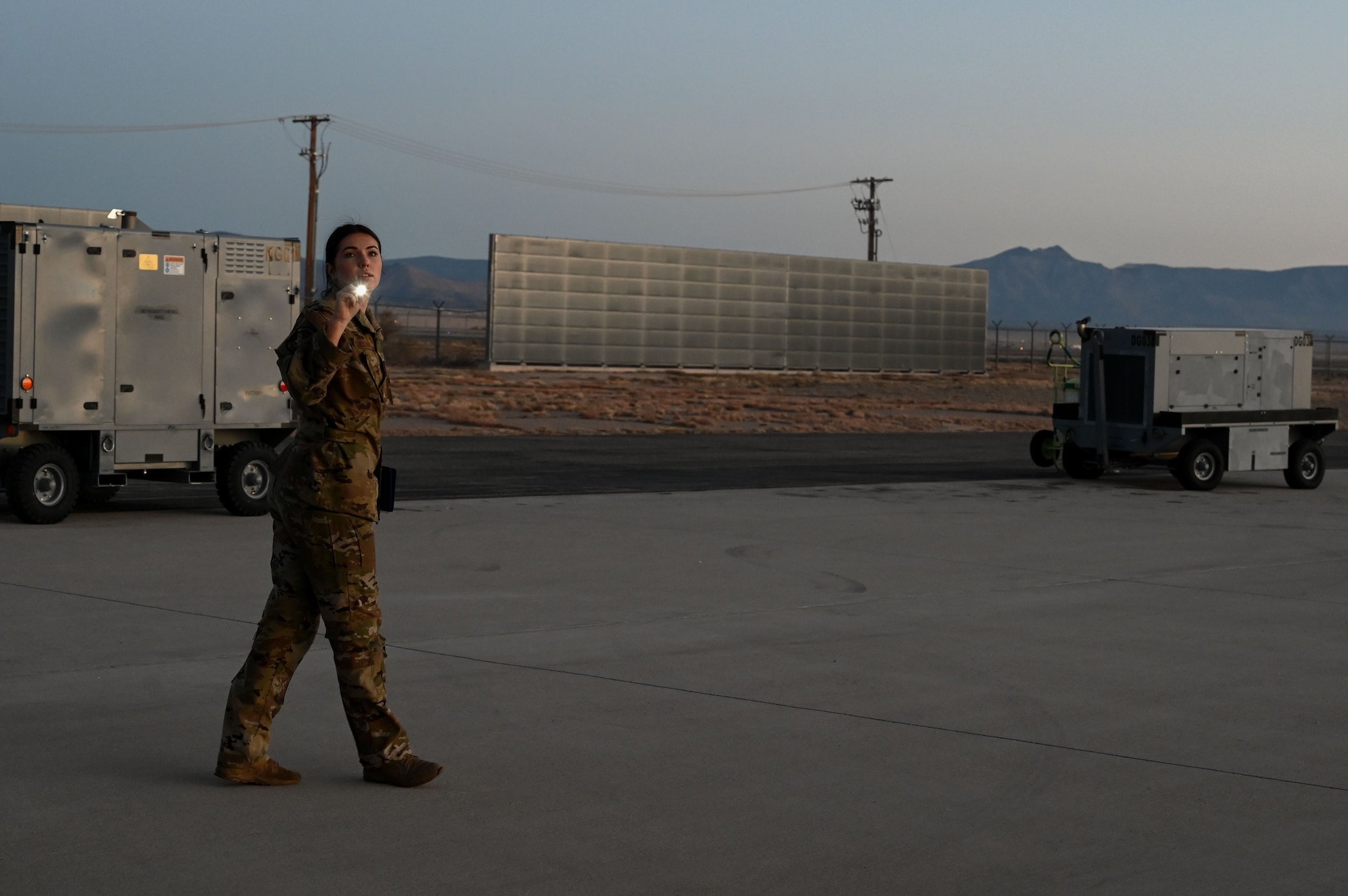 A loadmaster student performs pre-flight inspections.