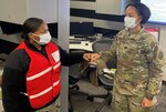 Two staff members giving each other a fist pound