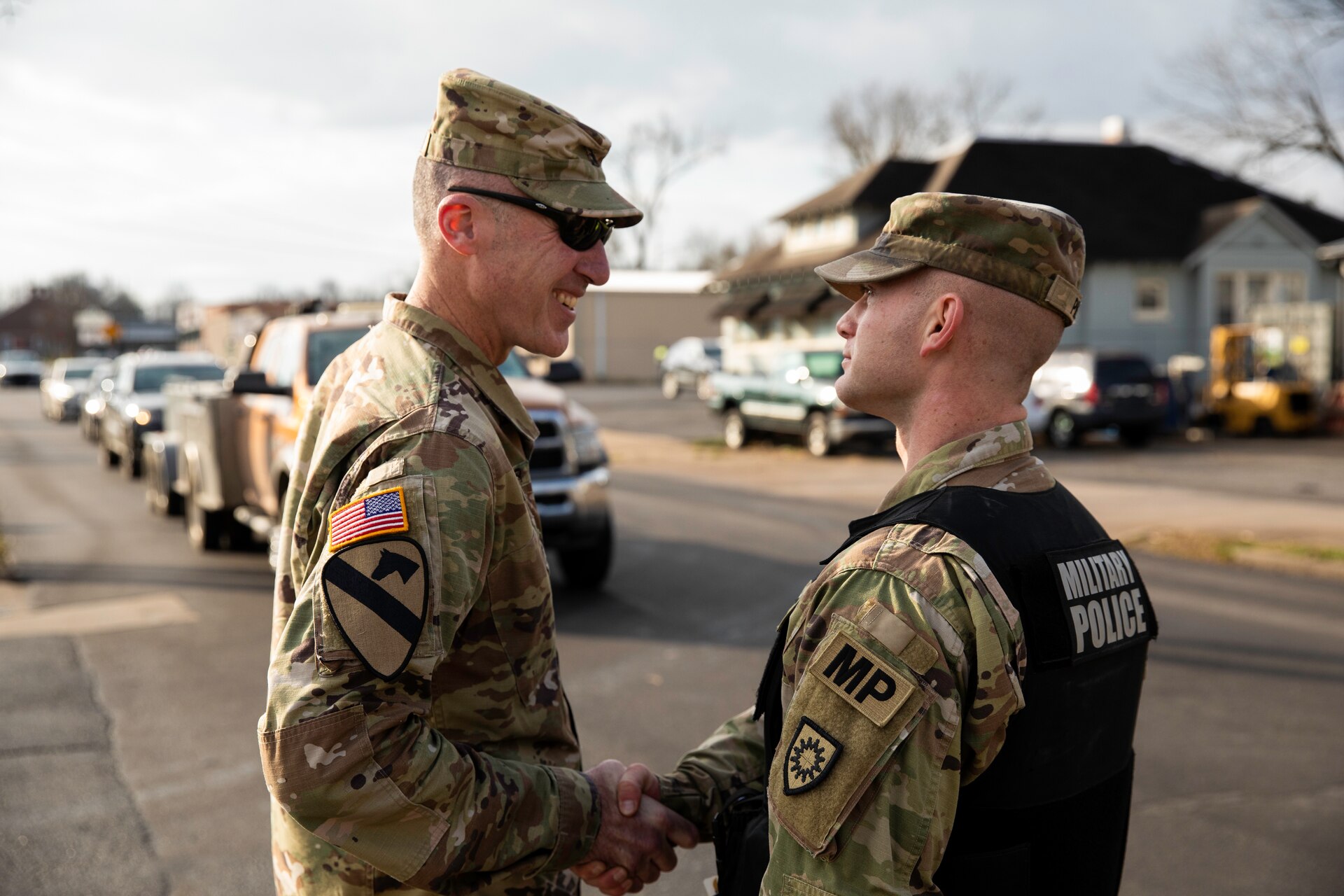 Kentucky Army National Guard's Sgt. Andrew Pile updates Brig. Gen. Brian Wertzler on traffic control points in Mayfield, Ky. on December 28th, 2021. Pile is a squad leader with the 223rd Military Police Company and has been conducting traffic control points in support of tornado relief (U.S. Army photo by Andy Dickson).