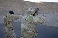 Utah Guardsmen competing in Utah’s Best Warrior Competition practice their pistol draw on Camp Williams, Nov. 7, 2021.