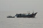 U.S. service members from coastal patrol ship USS Tempest (PC 2) and USS Typhoon (PC 5) interdict a stateless dhow carrying illicit drugs while transiting international waters in the Arabian Sea, Dec. 27. (U.S. Navy photo)