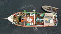 U.S. service members from coastal patrol ship USS Tempest (PC 2) and USS Typhoon (PC 5) inventory an illicit shipment of drugs while aboard a stateless dhow transiting international waters in the Arabian Sea, Dec. 27. (U.S. Navy photo)