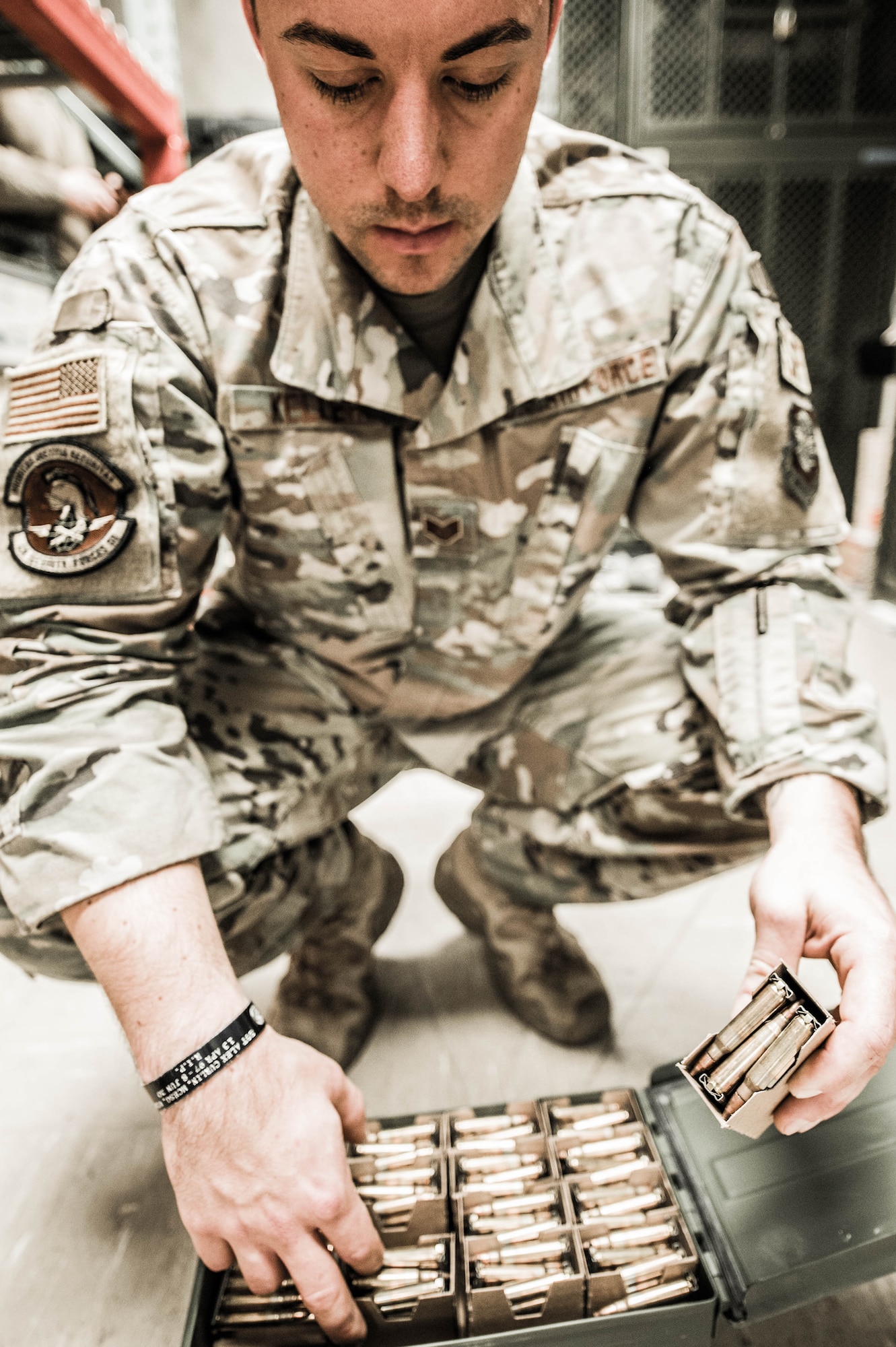 Staff Sgt. Christopher Keller, 436th Security Forces Squadron combat arms instructor, counts boxes of 5.56mm ammunition Dec. 17, 2021, at Dover Air Force Base, Delaware. Keller is one of five instructors at the Dover AFB Combat Arms Training and Maintenance facility. Each person receiving training is allotted an exact number of rounds to use during qualification. (U.S. Air Force photo by Mauricio Campino)