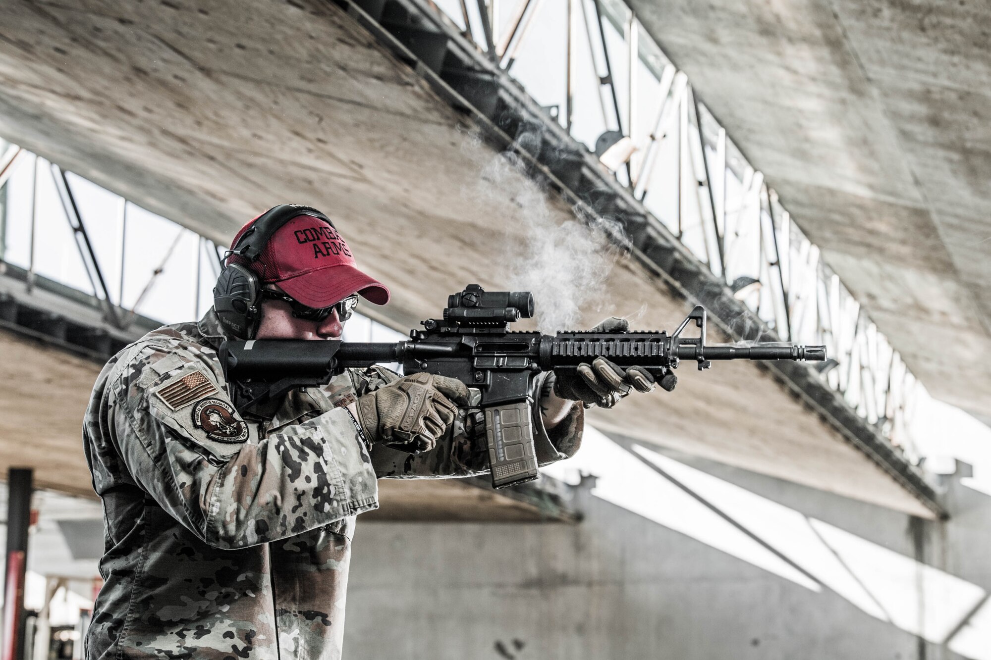 Staff Sgt. Christopher Keller, 436th Security Forces Squadron combat arms instructor, fires an M4 carbine Dec. 20, 2021, at Dover Air Force Base, Delaware. Keller is one of five instructors at the Dover AFB Combat Arms Training and Maintenance facility. Each instructor is allotted ammunition to practice throughout the year and maintain their skill level. (U.S. Air Force photo by Mauricio Campino)