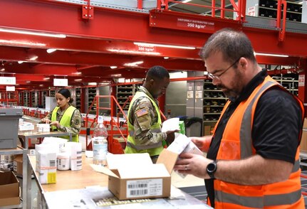 Soldiers and civilians sort medical supplies in a U.S. Army Medical Materiel Center-Europe warehouse in Kaiserslautern, Germany.