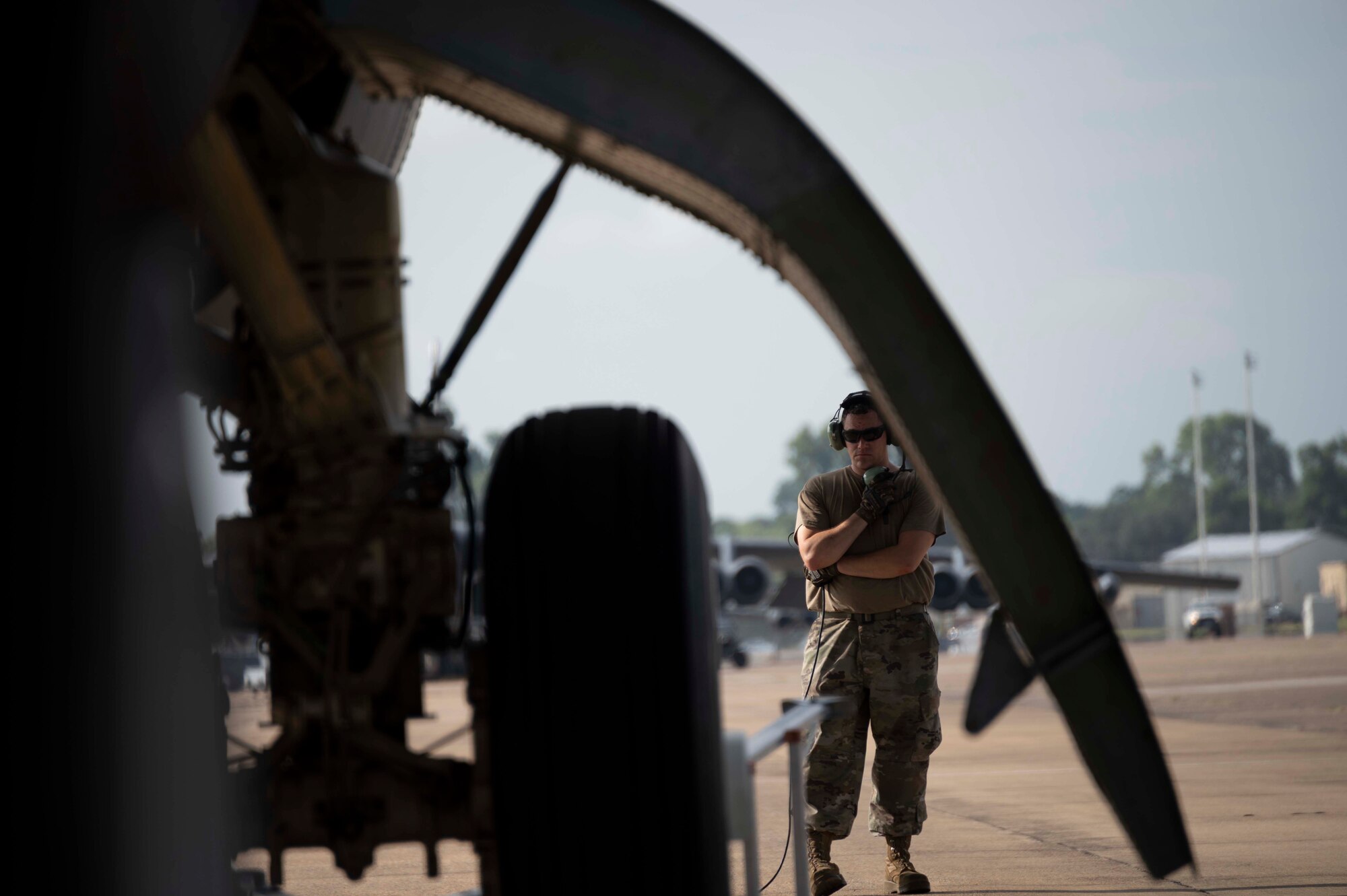 Photo of Airman standing by B-52