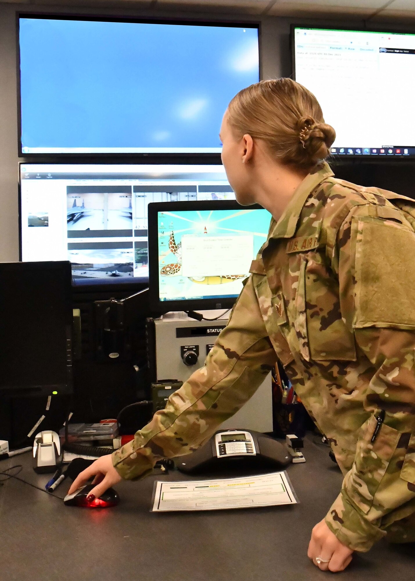 Staff Sgt. Chelsey Potter, 104th Fighter Wing command post controller, executes mission requirements December 3, 2021, at Barnes Air National Guard Base, Massachusetts. The command post is responsible for receiving and dispersing all information coming onto or leaving Barnes ANGB.  (U.S. Air National Guard photo by Staff Sgt. Sara Kolinski)