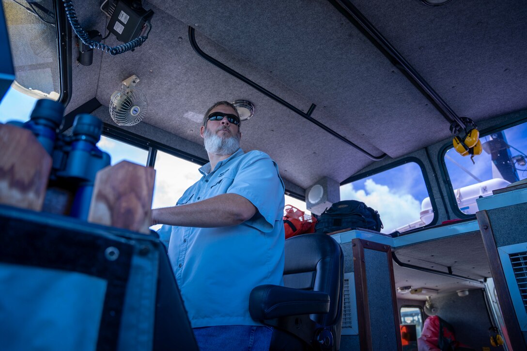 Chris Murden, a small craft operator for the U.S. Army Corps of Engineers Charleston District, navigates the Survey Vessel Evans