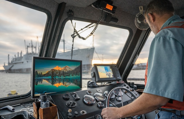 Chris Murden, a small craft operator for the U.S. Army Corps of Engineers Charleston District, navigates the Survey Vessel Evans