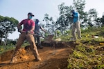 Members of a Defense POW/MIA Accounting Agency (DPAA) recovery team dig in an excavation unit during a DPAA recovery mission in Quang Nam Province, Vietnam. DPAA’s mission is to achieve the fullest possible accounting for missing and unaccounted-for U.S. personnel to their families and the nation. (U.S. Air Force photo by Staff Sgt. Jonathan McElderry)