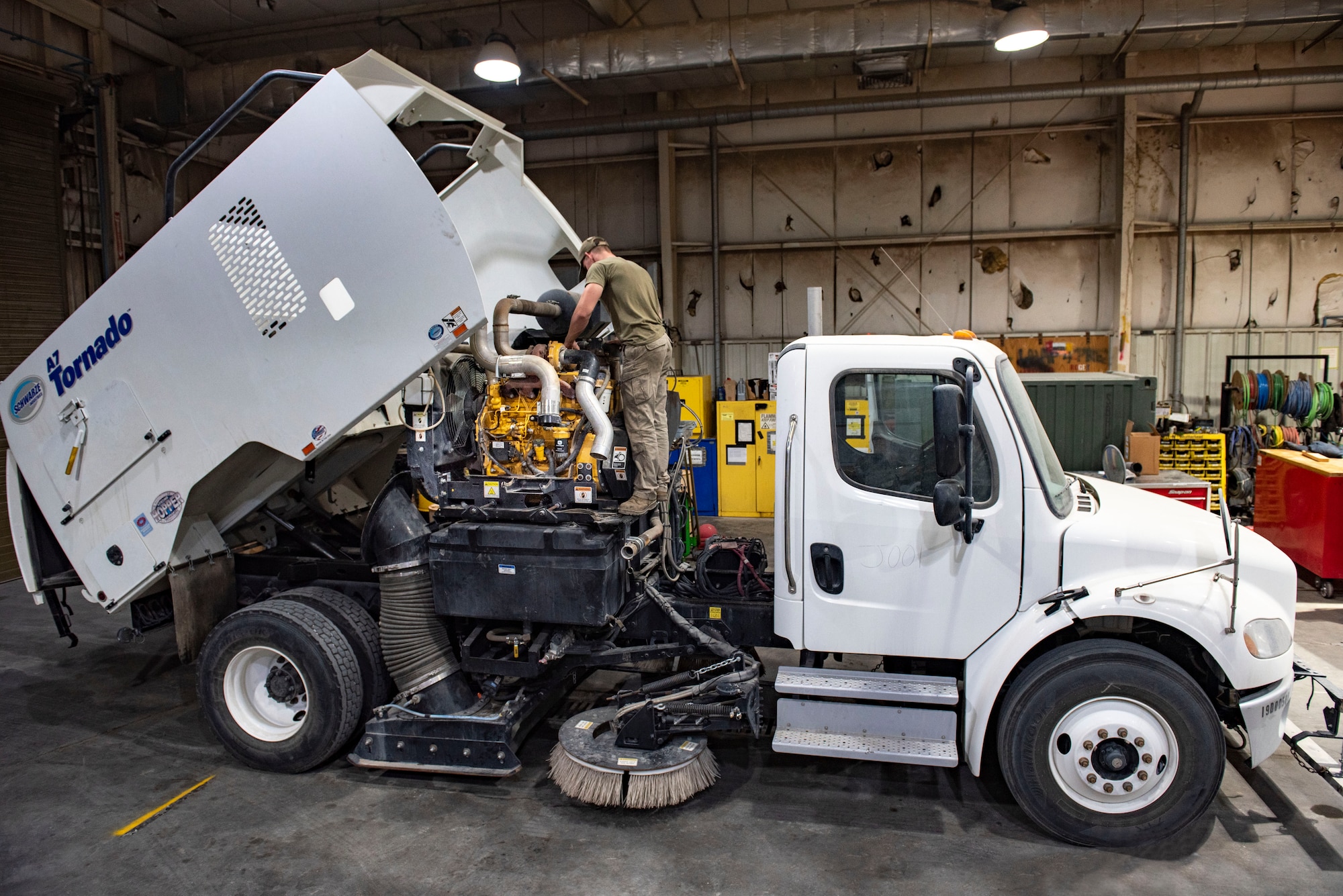 Airman 1st Class Mitchell Dise, a 386th Expeditionary Logistics Readiness Squadron vehicle maintenance technician, replaces the sub-frame of a Tornado sweeper truck at Ali Al Salem Air Base, Kuwait, Nov. 8, 2021. The 386th ELRS vehicle management flight and the 386th Expeditionary Maintenance Squadron metals technology collaborated to repair this vehicle to combat foreign object debris on the flightline. (U.S. Air Force photo by Staff Sgt. Ryan Brooks)