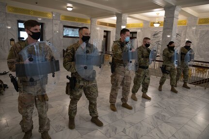 Airmen from the 151st Security Forces Squadron, Utah Air National Guard, practice shield techniques at the Utah State Capitol on Jan. 18, 2021.