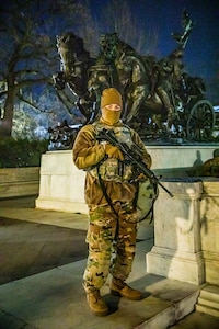 A U.S. Soldier with the Virginia Army National Guard, patrols his sector near the Ulysses S. Grant Memorial, in Washington D.C