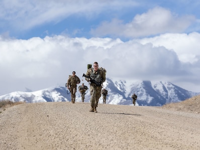 Soldiers endure a six-mile ruck march back to garrison during the Utah National Guard Best Warrior Competition at Camp Williams, Utah