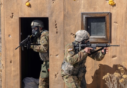 Soldiers react to enemy contact as part of the Utah National Guard Best Warrior Competition at Camp Williams, Utah