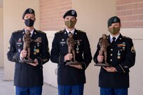 The winners of the Utah Best Warrior Competition stand with trophies