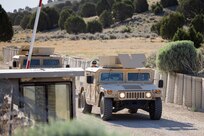 Military vehicles leave encampment