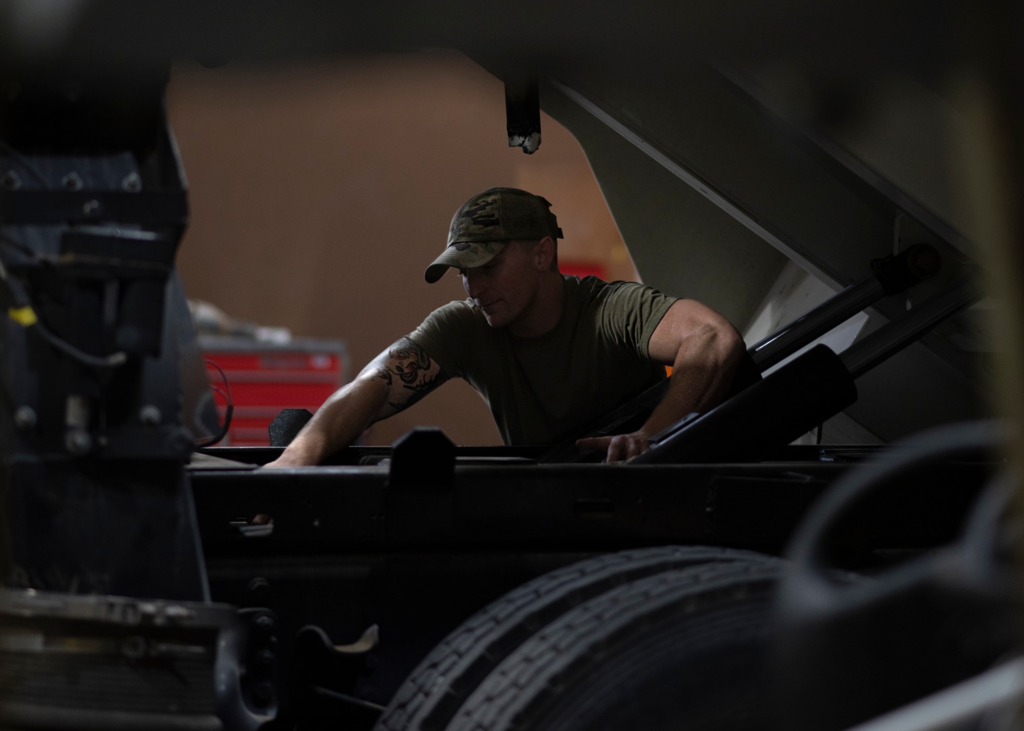 Airman 1st Class Mitchell Dise, a 386th Expeditionary Logistics Readiness Squadron vehicle maintenance technician, works on the sub-frame of a Tornado sweeper truck at Ali Al Salem Air Base, Kuwait, Nov. 8, 2021. The 386th ELRS vehicle management flight and the 386th Expeditionary Maintenance Squadron metals technology collaborated to repair this truck to combat foreign object debris on the flightline. (U.S. Air Force photo by Staff Sgt. Ryan Brooks)