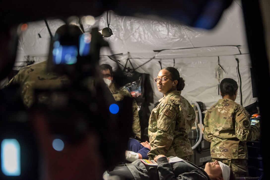 Senior Airman Kennedy Powell, a medical technician from the Kentucky Air National Guard’s 123rd Medical Group Detachment 1, is filmed tending to simulated patients at the Kentucky Air National Guard Base in Louisville, Ky., on April 16, 2021. The footage is being used for a national ad campaign funded by the National Guard Bureau to advertise the Air National Guard. (U.S. Air National Guard photo by Tech. Sgt. Joshua Horton)