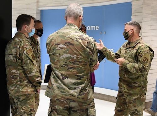Photo of men talking