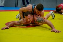 U.S. Marine Corps Capt. Peyton Walsh, top, and Staff Sgt. John Stefanowicz, bottom, with the All-Marine Wrestling Team (AMWT), hone their wrestling techniques to prepare for the Olympic Trials, on Marine Corps Air Station New River, North Carolina, Jan. 8, 2021. Members of the AMWT are preparing for the trials, scheduled for April 2021 at Penn State University for a chance to represent the U.S. in the 2020 Olympics. (U.S. Marine Corps photo by Lance Cpl. Christian Ayers)
