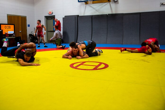 U.S. Marines with the All-Marine Wrestling Team (AMWT), practice wrestling techniques to prepare for the Olympic Trials, on Marine Corps Air Station New River, North Carolina, Jan. 8, 2021. Members of the AMWT are preparing for the trials, scheduled for April 2021 at Penn State University, for a chance to represent the U.S. in the 2020 Olympics. (U.S. Marine Corps photo by Lance Cpl. Christian Ayers)