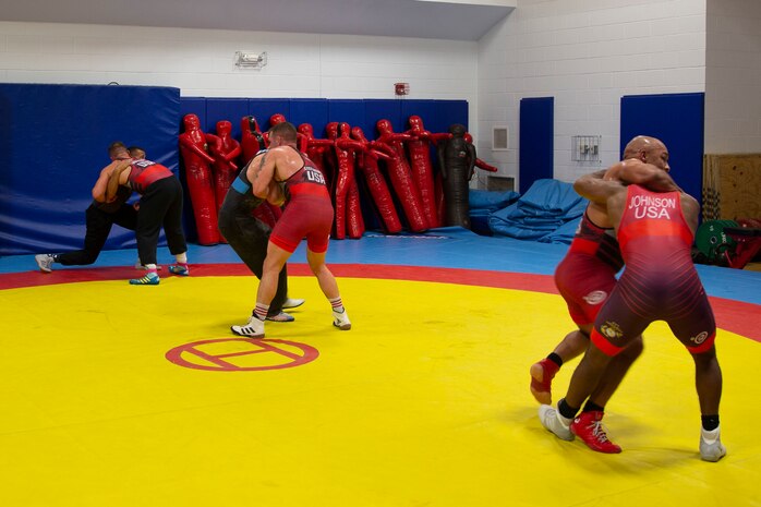 U.S. Marines with the All-Marine Wrestling Team (AMWT), practice wrestling techniques to prepare for the Olympic Trials, on Marine Corps Air Station New River, North Carolina, Jan. 8, 2021. Members of the AMWT are preparing for the trials, scheduled for April 2021 at Penn State University, for a chance to represent the U.S. in the 2020 Olympics. (U.S. Marine Corps photo by Lance Cpl. Christian Ayers)