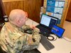 Chief Warrant Officer 3 Jeremy Marroncelli works with high school students interested in cyber operations during a virtual “Wi-Fighter Cyber Challenge” exercise Jan. 5, 2020.