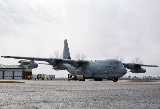 U.S. Marines conduct training unloading M142 High Mobility Artillery Rocket Systems from a Lockheed C-130 Hercules on Marine Corps Air Station New River, North Carolina, Jan. 26, 2020. MCAS New River provided training for Marines to unload M142 HIMARS. (U.S. Marine Corps photo by Cpl. Ginnie Lee)
