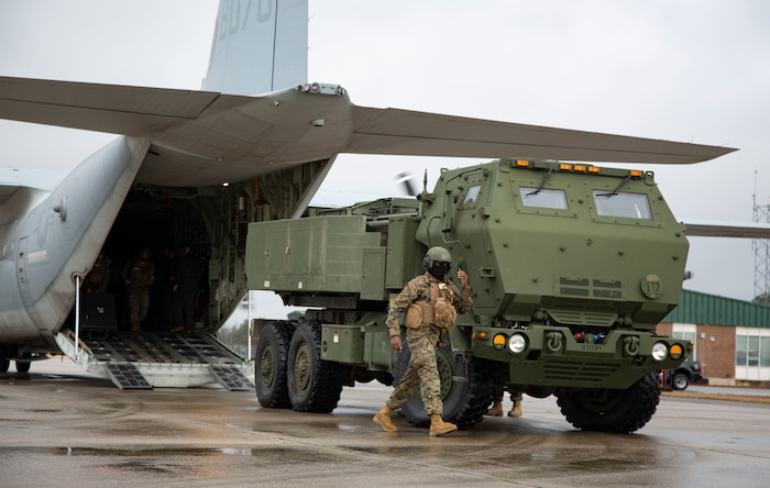 U.S. Marines conduct checks on a M142 High Mobility Artillery Rocket System after being unloading from a Lockheed C-130 Hercules during  training on Marine Corps Air Station New River, North Carolina, Jan. 26, 2020. MCAS New River provided training that included unloading M142 HIMARS from a Lockheed C-130. (U.S. Marine Corps photo by Cpl. Ginnie Lee)