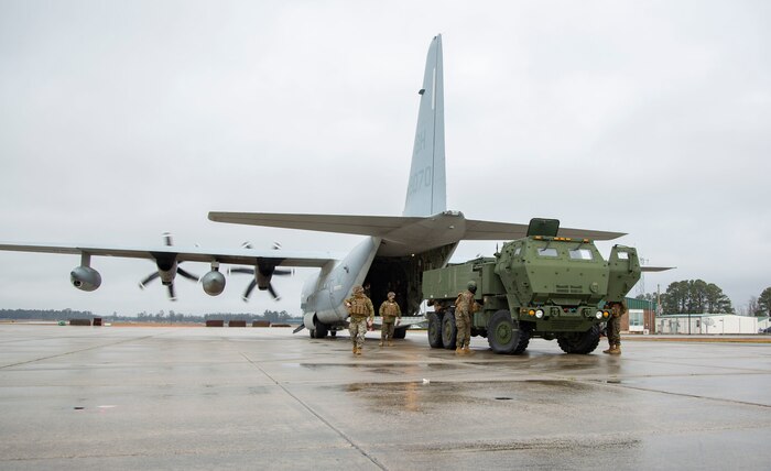 U.S. Marines conduct checks on a M142 High Mobility Artillery Rocket System after being unloaded from a Lockhead C-130 Hercules during training on Marine Corps Air Station New River, North Carolina, Jan. 26, 2020. MCAS New River provided training that included unloading M142 HIMARS from a Lockheed C-130 Hercules. (U.S. Marine Corps photo by Cpl. Ginnie Lee)