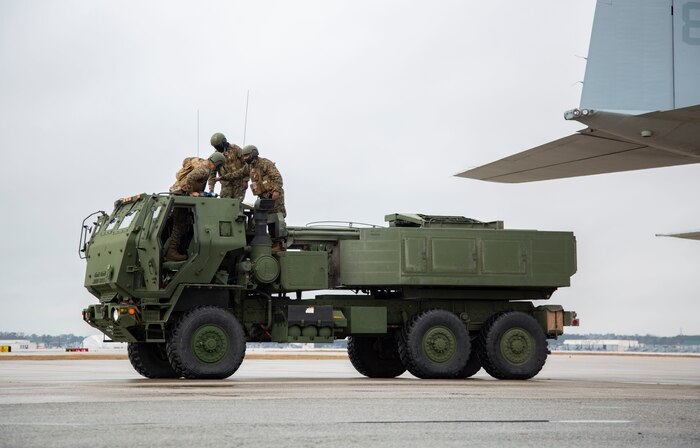 U.S. Marines conduct checks on a M142 High Mobility Artillery Rocket System after being unloaded from a Lockhead C-130 Hercules during training on Marine Corps Air Station New River, North Carolina, Jan. 26, 2020. MCAS New River provided training that included unloading M142 HIMARS from a Lockhead C-130 Hercules. (U.S. Marine Corps photo by Cpl. Ginnie Lee)