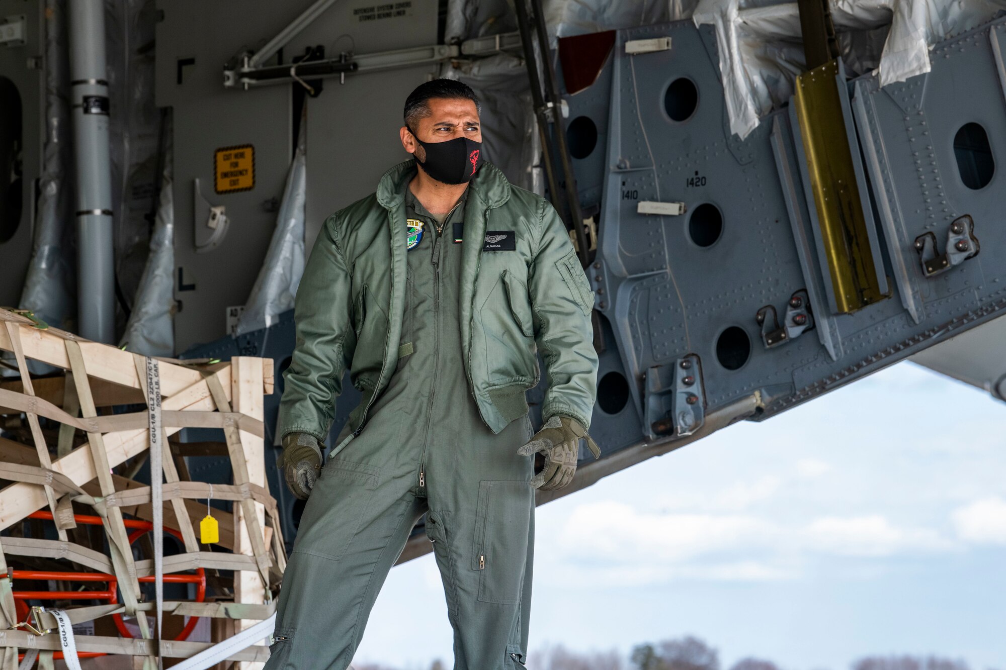 A Kuwait air force airman looks out of the ramp of a Kuwait air force C-17 Globemaster III at Dover Air Force Base, Delaware, Jan. 22, 2021. The U.S. strongly supports Kuwait’s sovereignty, security and independence as well as its multilateral diplomatic efforts to build greater cooperation in the region. Due to its strategic geographic location, Dover AFB supports approximately $3.5 billion worth of foreign military sales operations annually. (U.S. Air Force photo by Senior Airman Christopher Quail)