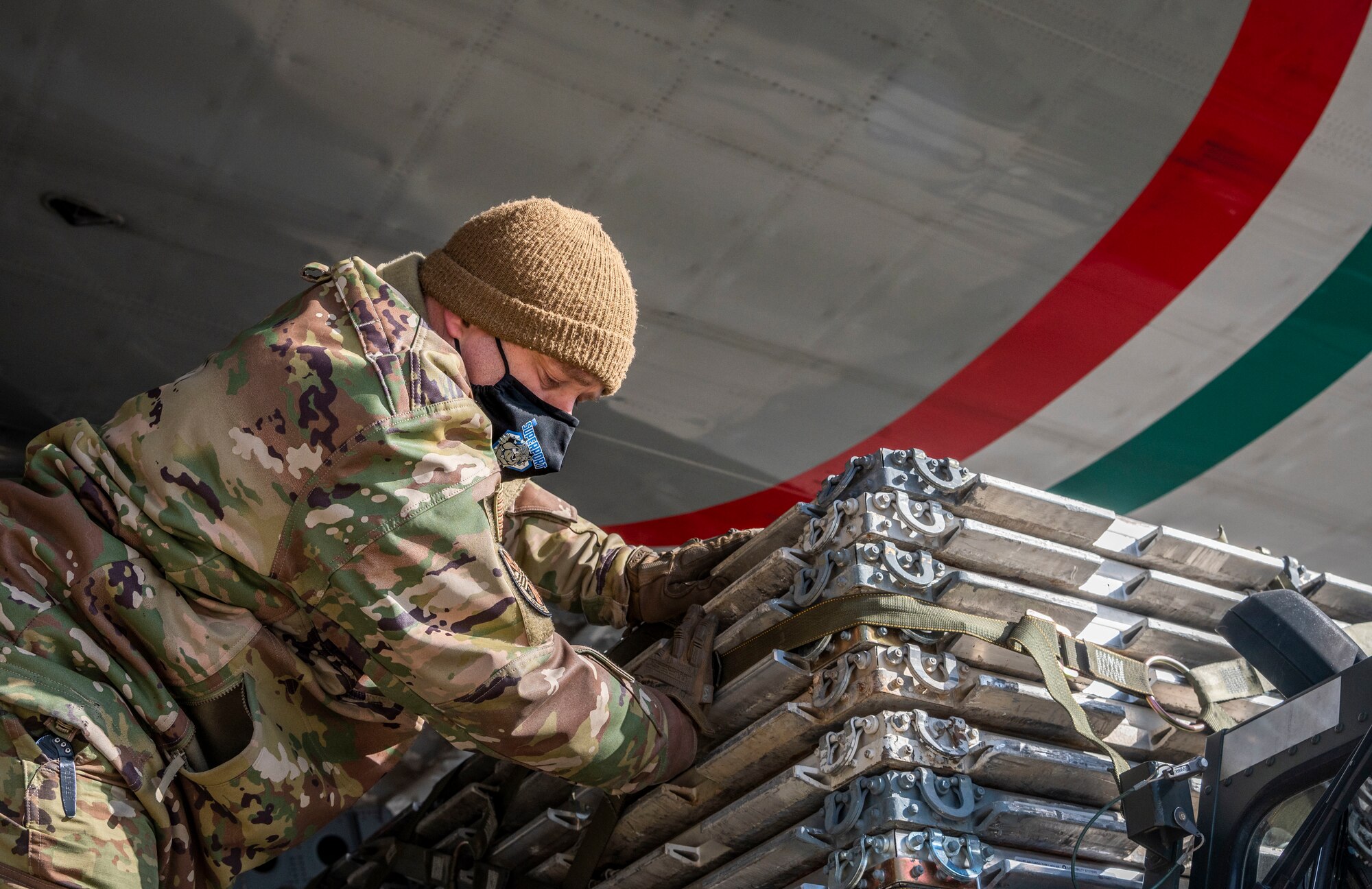 Tech. Sgt. Ryan Price, 436th Aerial Port Squadron ramp operations shift supervisor, unloads cargo from a Kuwait air force C-17 Globemaster III at Dover Air Force Base, Delaware, Jan. 22, 2021. The U.S. strongly supports Kuwait’s sovereignty, security and independence as well as its multilateral diplomatic efforts to build greater cooperation in the region. Due to its strategic geographic location, Dover AFB supports approximately $3.5 billion worth of foreign military sales operations annually. (U.S. Air Force photo by Senior Airman Christopher Quail)