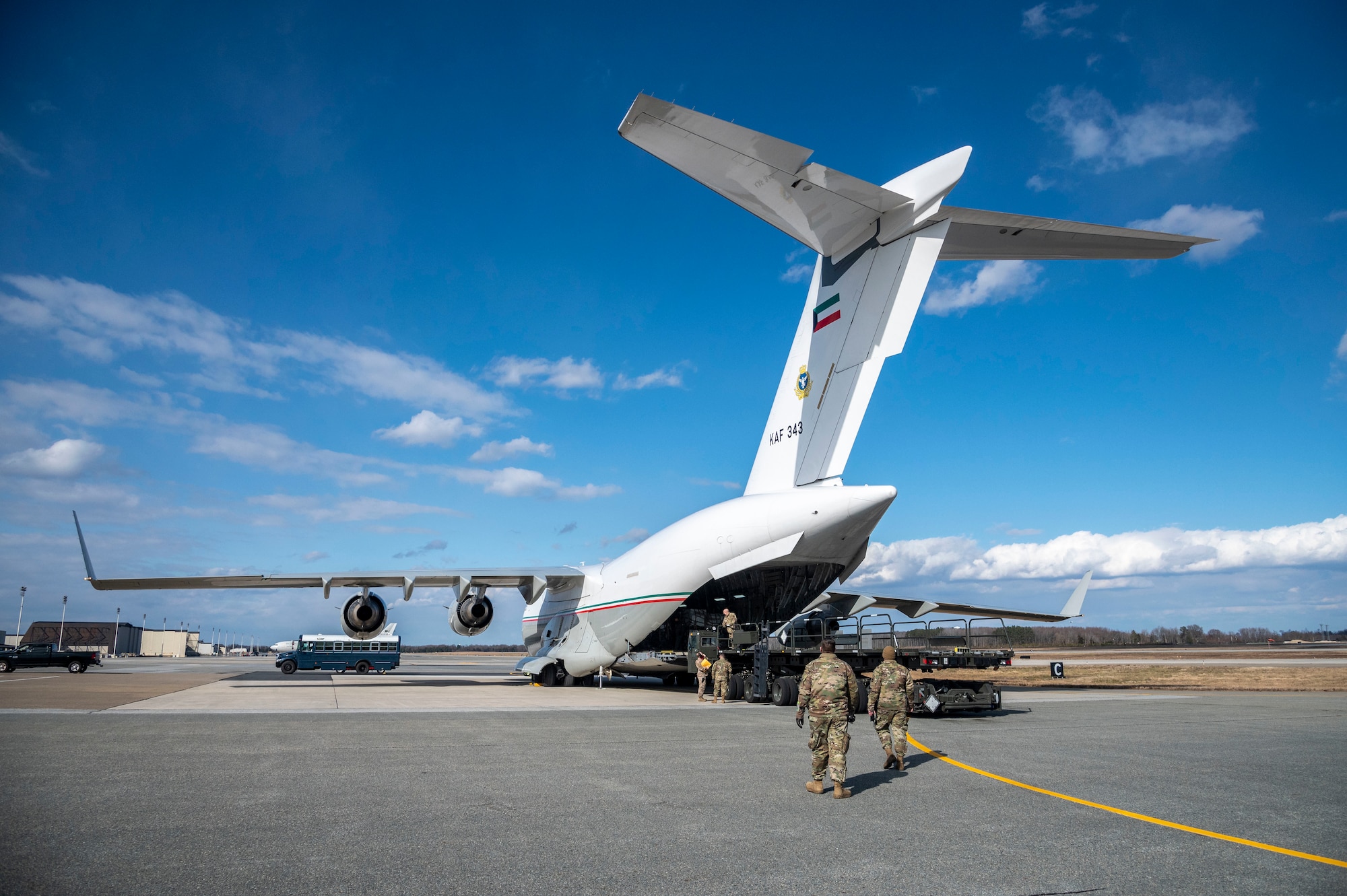 Airmen from the 436th Aerial Port Squadron finish loading cargo in support of a foreign military sales operation with the Kuwait air force at Dover Air Force Base, Delaware, Jan. 22, 2021. Kuwait is an important partner in U.S. counterterrorism efforts, providing assistance in the military, diplomatic, and intelligence arenas and also supporting efforts to block financing of terrorist groups. Due to its strategic geographic location, Dover AFB supports approximately $3.5 billion worth of foreign military sales operations annually. (U.S. Air Force photo by Senior Airman Christopher Quail)