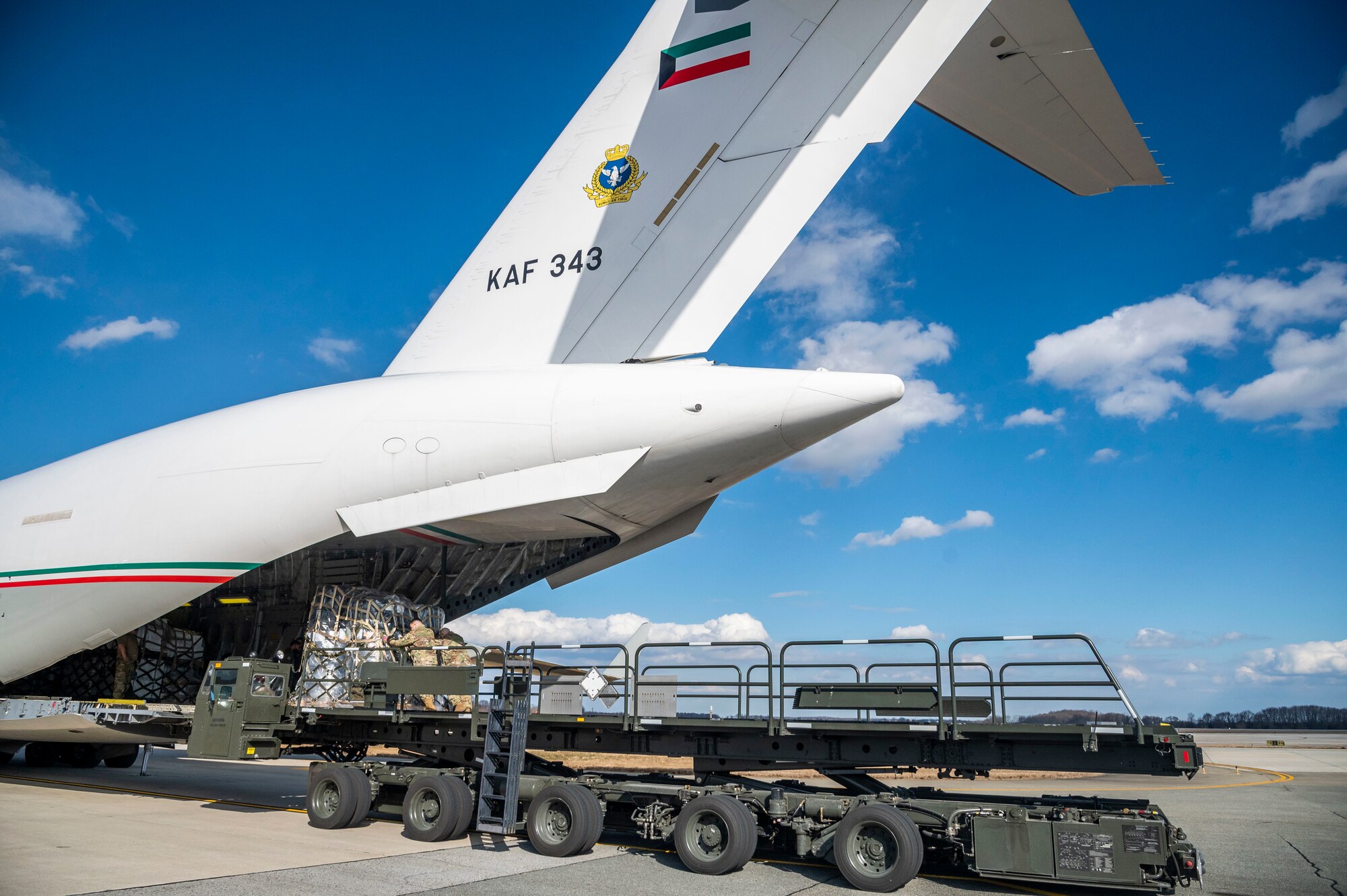 Airmen from the 436th Aerial Port Squadron move cargo onto a Kuwait air force C-17 Globemaster III at Dover Air Force Base, Delaware, Jan. 22, 2021. Kuwait is an important partner in U.S. counterterrorism efforts, providing assistance in the military, diplomatic, and intelligence arenas and also supporting efforts to block financing of terrorist groups. Due to its strategic geographic location, Dover AFB supports approximately $3.5 billion worth of foreign military sales operations annually. (U.S. Air Force photo by Senior Airman Christopher Quail)