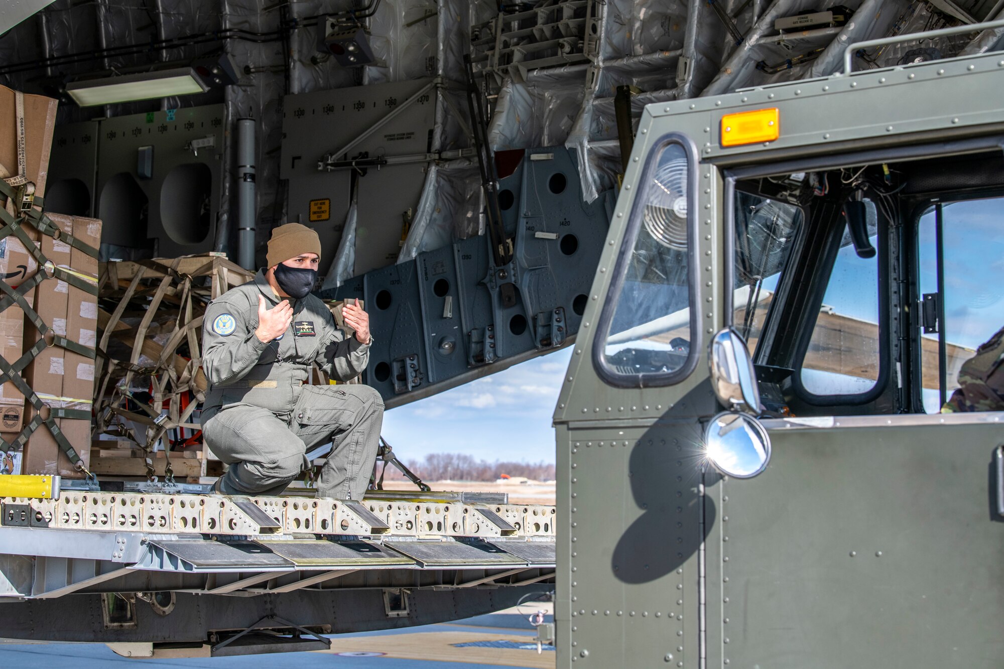 A Kuwait air force airman guides a K-loader onto the ramp of a Kuwait air force C-17 Globemaster III at Dover Air Force Base, Delaware, Jan. 22, 2021. The U.S. strongly supports Kuwait’s sovereignty, security and independence as well as its multilateral diplomatic efforts to build greater cooperation in the region. Due to its strategic geographic location, Dover AFB supports approximately $3.5 billion worth of foreign military sales operations annually. (U.S. Air Force photo by Senior Airman Christopher Quail)