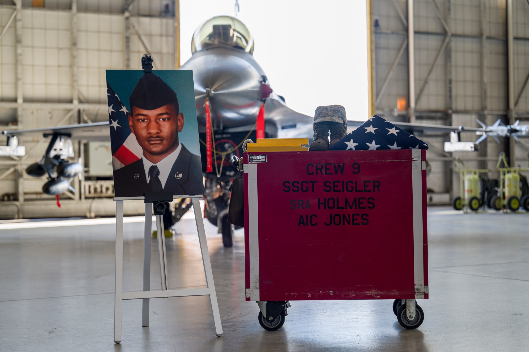 Airmen from 412th Maintenance Squadron held a memorial ceremony for Senior Airman Robert Holmes, Jr., at Edwards Air Force Base, California, Jan. 29. Holmes was assigned to the 416th Aircraft Maintenance Unit Weapons Section, where he worked as a weapons load crew team member on a fleet of 25 F-16 Fighting Falcons. Holmes was  awarded Air Force Achievement Medal posthumously. (Air Force photo by Giancarlo Casem)