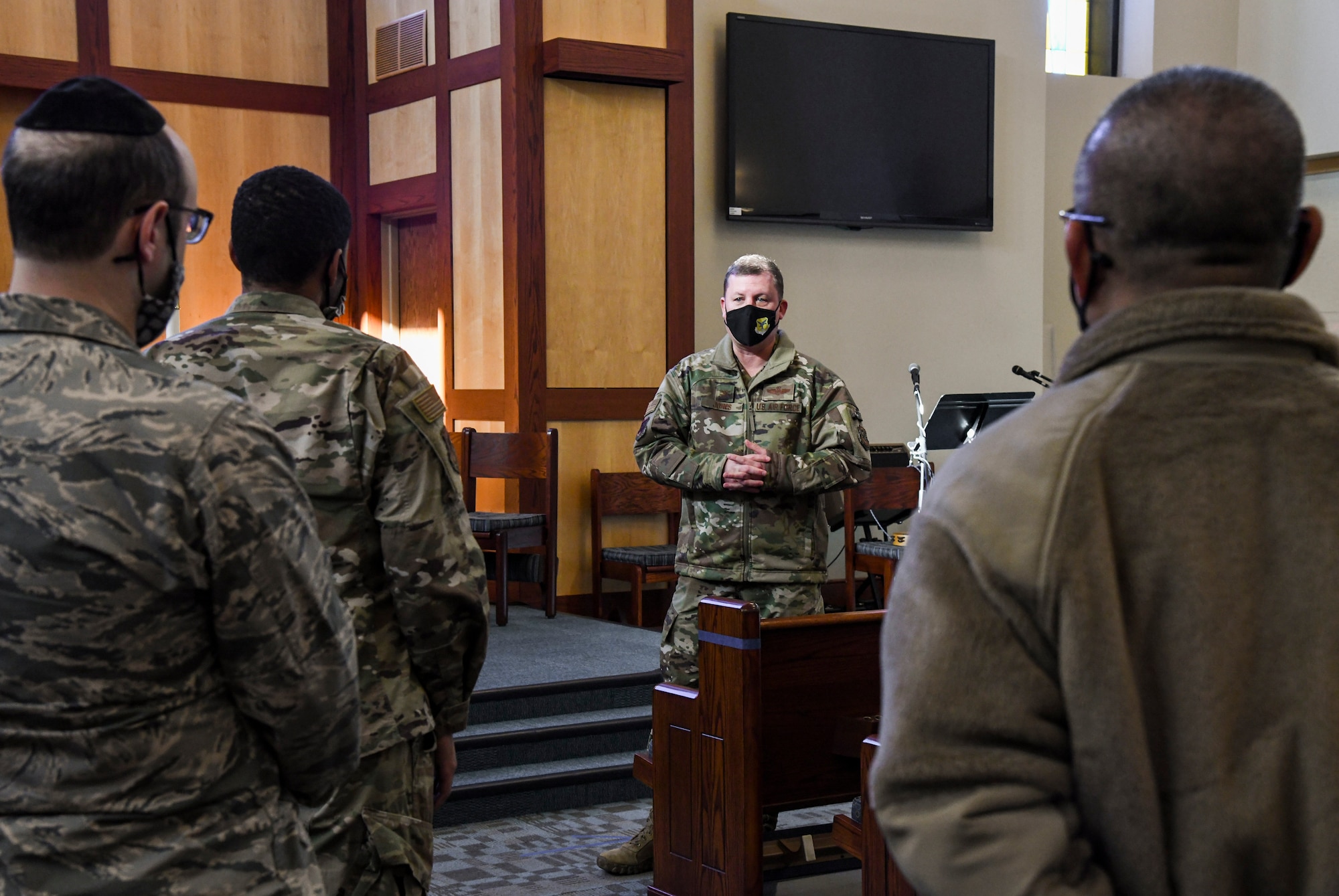Col. Matthew Jones, 436th Airlift Wing commander, discusses resiliency with members of the 436th Airlift Wing chapel team during a relaxation room grand opening at Chapel 1 on Dover Air Force Base, Delaware, Jan. 21, 2021. Religious support teams are composed of one Air Force chaplain and one religious affairs Airman at every organizational level. They advise leadership while also providing spiritual care and spiritual resilience coaching tailored to the needs of all Airmen and their authorized dependents. (U.S. Air Force photo by Airman 1st Class Stephani Barge)