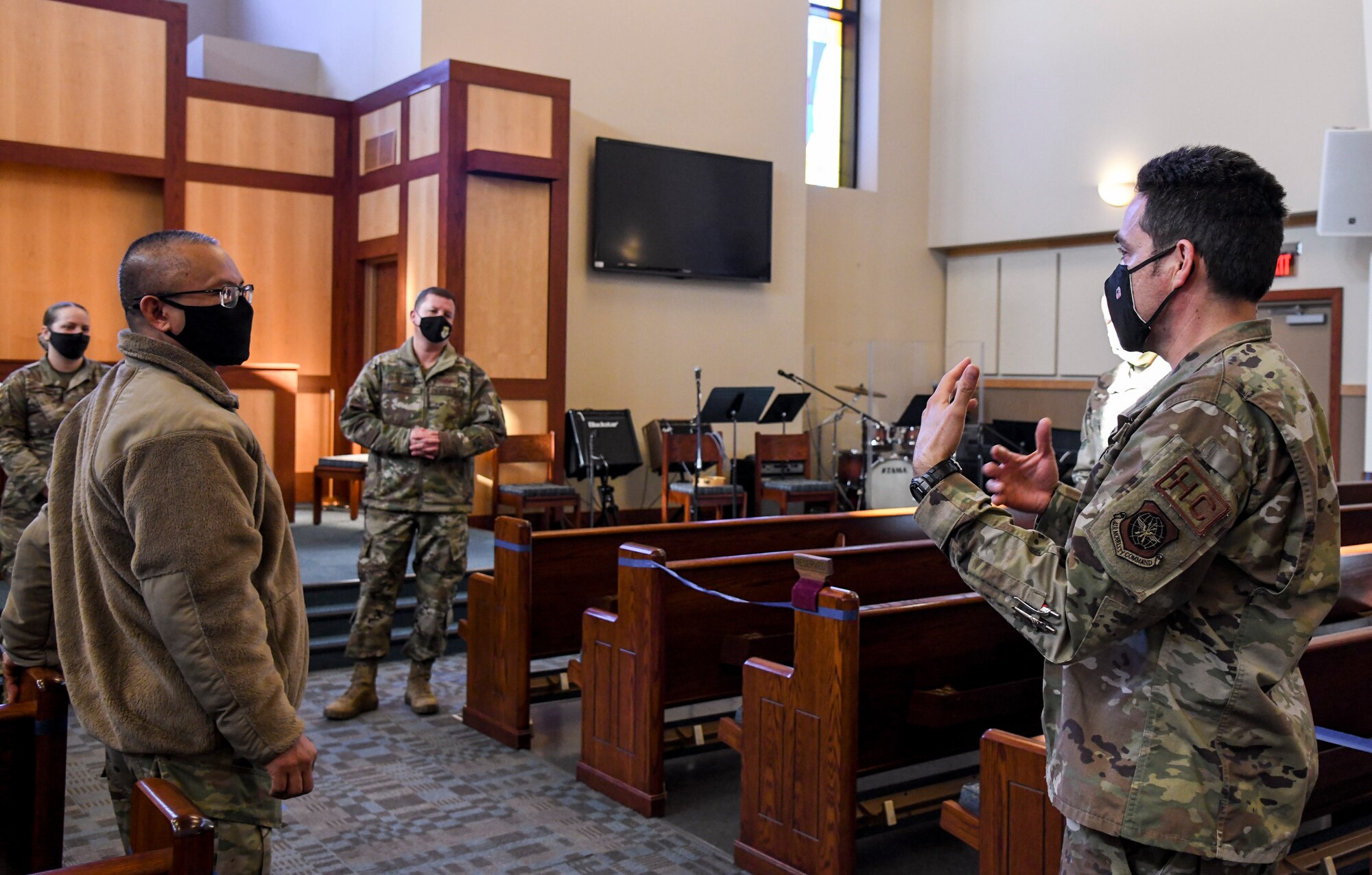 Capt. Ryan Taylor-Byers, 436th Airlift Wing chaplain, discusses resiliency with Col. Matthew Jones, 436th AW commander, and members of the 436th AW chapel team during a relaxation room grand opening at Chapel 1 on Dover Air Force Base, Delaware, Jan. 21, 2021. Religious support teams are composed of one Air Force chaplain and one religious affairs Airman at every organizational level. They advise leadership while also providing spiritual care and spiritual resilience coaching tailored to the needs of all Airmen and their authorized dependents. (U.S. Air Force photo by Airman 1st Class Stephani Barge)