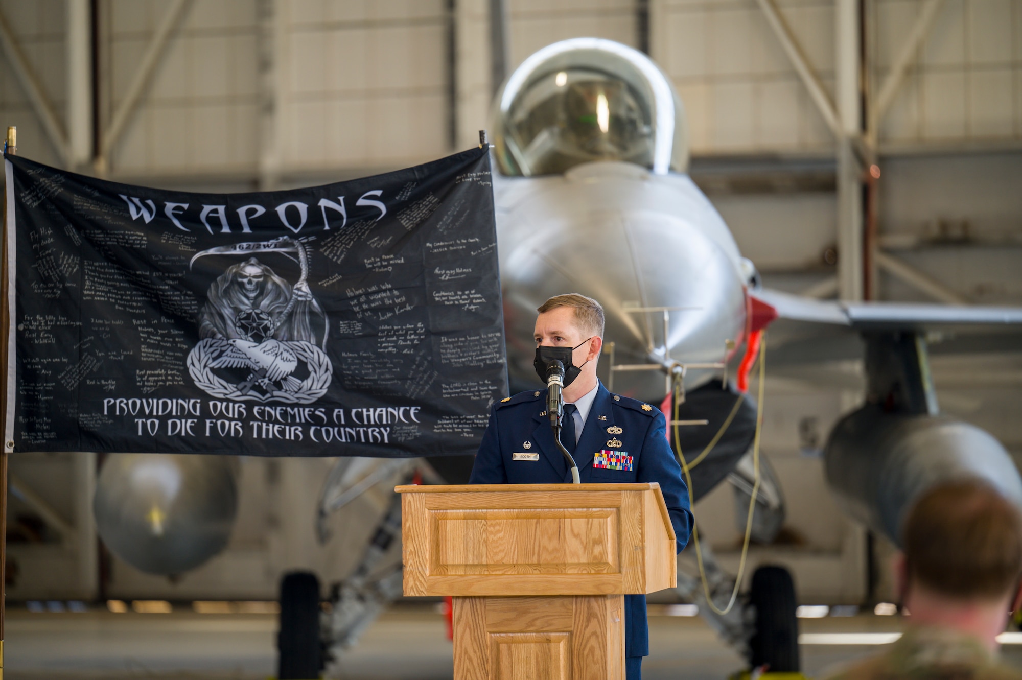 Maj. Robert Booth, 412th Aircraft Maintenance Squadron Commander, offers his remarks during a memorial ceremony for Senior Airman Robert Holmes, Jr., at Edwards Air Force Base, California, Jan. 29. Holmes was assigned to the 416th Aircraft Maintenance Unit Weapons Section and passed away Jan. 13. Holmes was awarded Air Force Achievement Medal posthumously. (Air Force photo by Giancarlo Casem)
