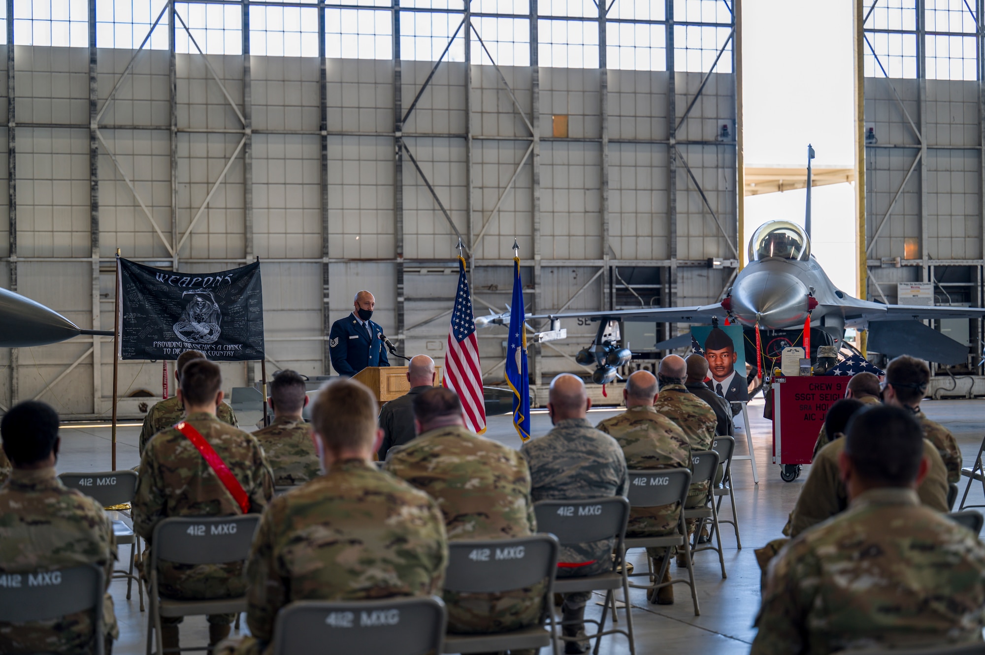 Tech. Sgt. Matthew Seigler, 412th Maintenance Group, offers his remarks during a memorial ceremony for Senior Airman Robert Holmes, Jr., at Edwards Air Force Base, California, Jan. 29. Holmes was assigned to the 416th Aircraft Maintenance Unit Weapons Section and passed away Jan. 13. Holmes was awarded Air Force Achievement Medal posthumously. (Air Force photo by Giancarlo Casem)