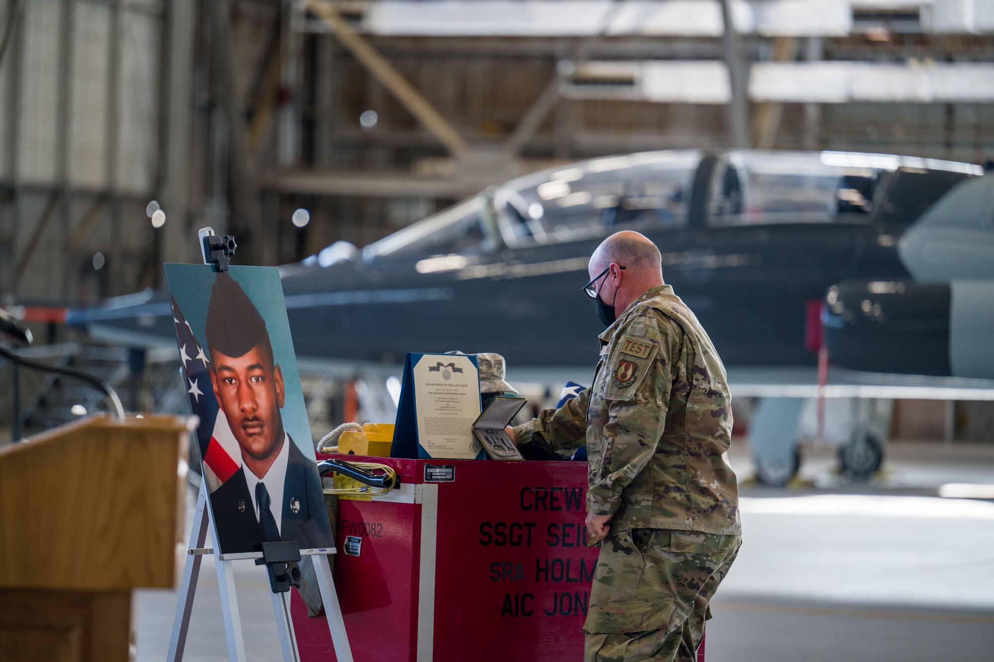 An Airman from 412th Maintenance Squadron bids farewell to Senior Airman Robert Holmes, Jr., at Edwards Air Force Base, California, Jan. 29. Holmes was assigned to the 416th Aircraft Maintenance Unit Weapons Section, where he worked as a weapons load crew team member on a fleet of 25 F-16 Fighting Falcons. Holmes was awarded Air Force Achievement Medal posthumously. (Air Force photo by Giancarlo Casem)