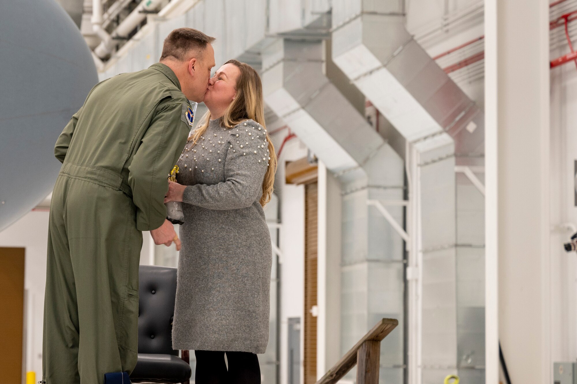 Lt. Col. Bryan Bailey, 911th Operations Group commander, kisses his wife Aaron Bailey during an assumption of command for the 911th OG at the Pittsburgh International Airport Air Reserve Station, Pennsylvania, Jan. 10, 2021.