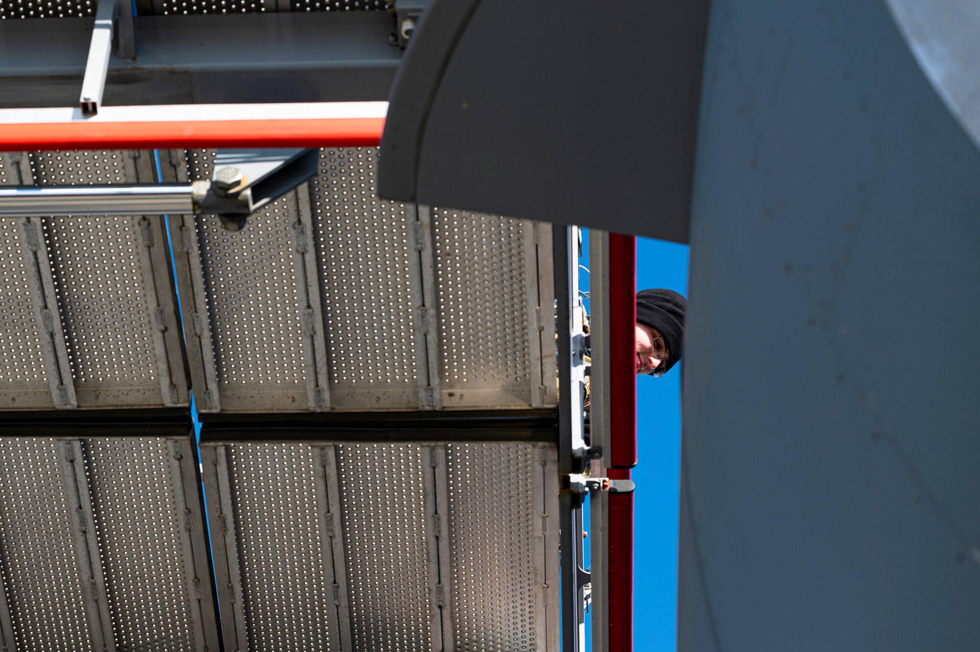 Senior Airman Thomas King, 911th Aircraft Maintenance Squadron aerospace propulsion technician, aligns a maintenance stand next to a C-17 Globemaster III engine to perform maintenance at the Pittsburgh International Airport Air Reserve Station, Pennsylvania, Dec. 29, 2020.