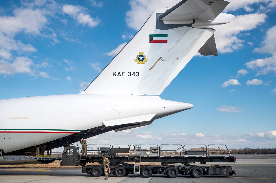 Airmen from the 436th Aerial Port Squadron finish loading cargo in support of a foreign military sales operation with the Kuwait air force at Dover Air Force Base, Delaware, Jan. 22, 2021. Kuwait is an important partner in U.S. counterterrorism efforts, providing assistance in the military, diplomatic, and intelligence arenas and also supporting efforts to block financing of terrorist groups. Due to its strategic geographic location, Dover AFB supports approximately $3.5 billion worth of foreign military sales operations annually. (U.S. Air Force photo by Senior Airman Christopher Quail)