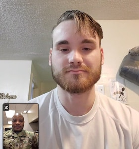 Two men talk in a video chat