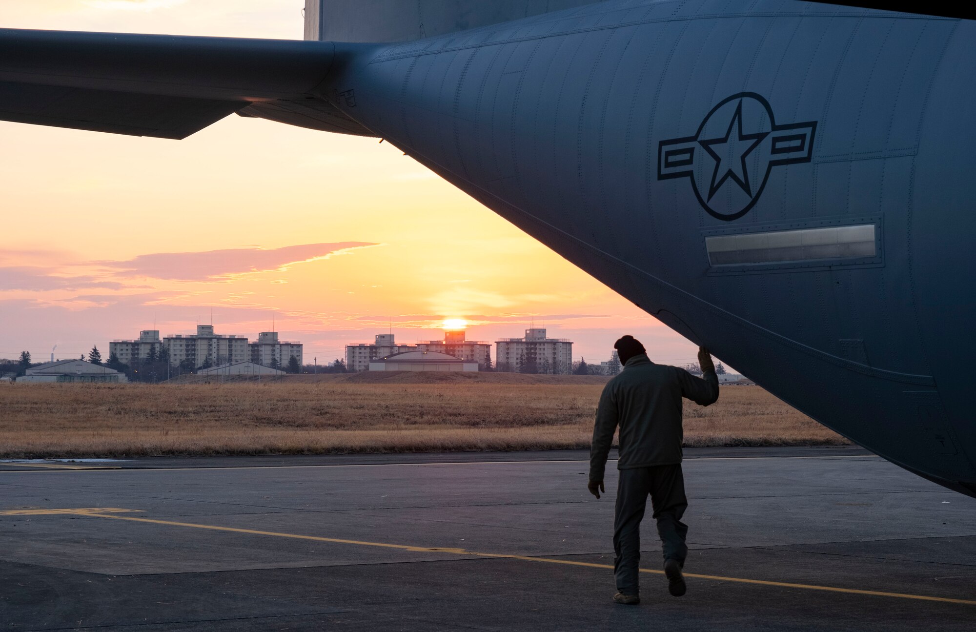 Tech. Sgt. Brian Gates, 36th Airlift Squadron loadmaster, performs pre-flight checks on a C-130J Super Hercules, at Yokota Air Base, Japan, Jan. 22, 2021.